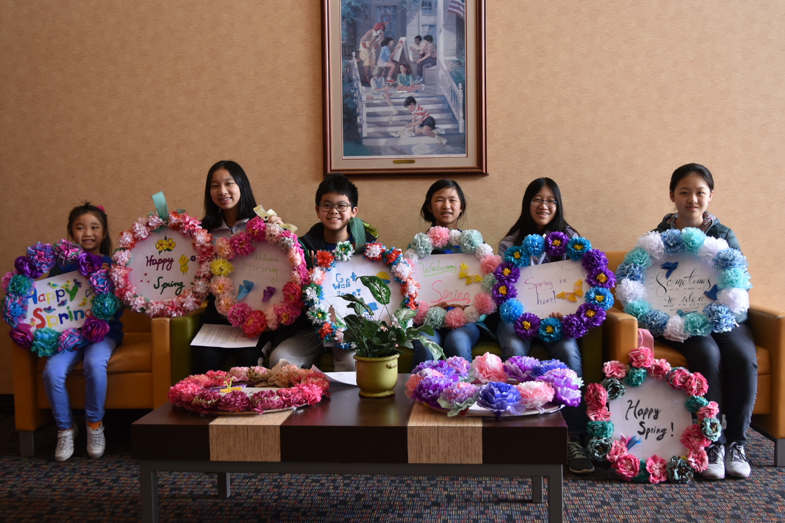 PCA Youth Center students showing their spring art projects