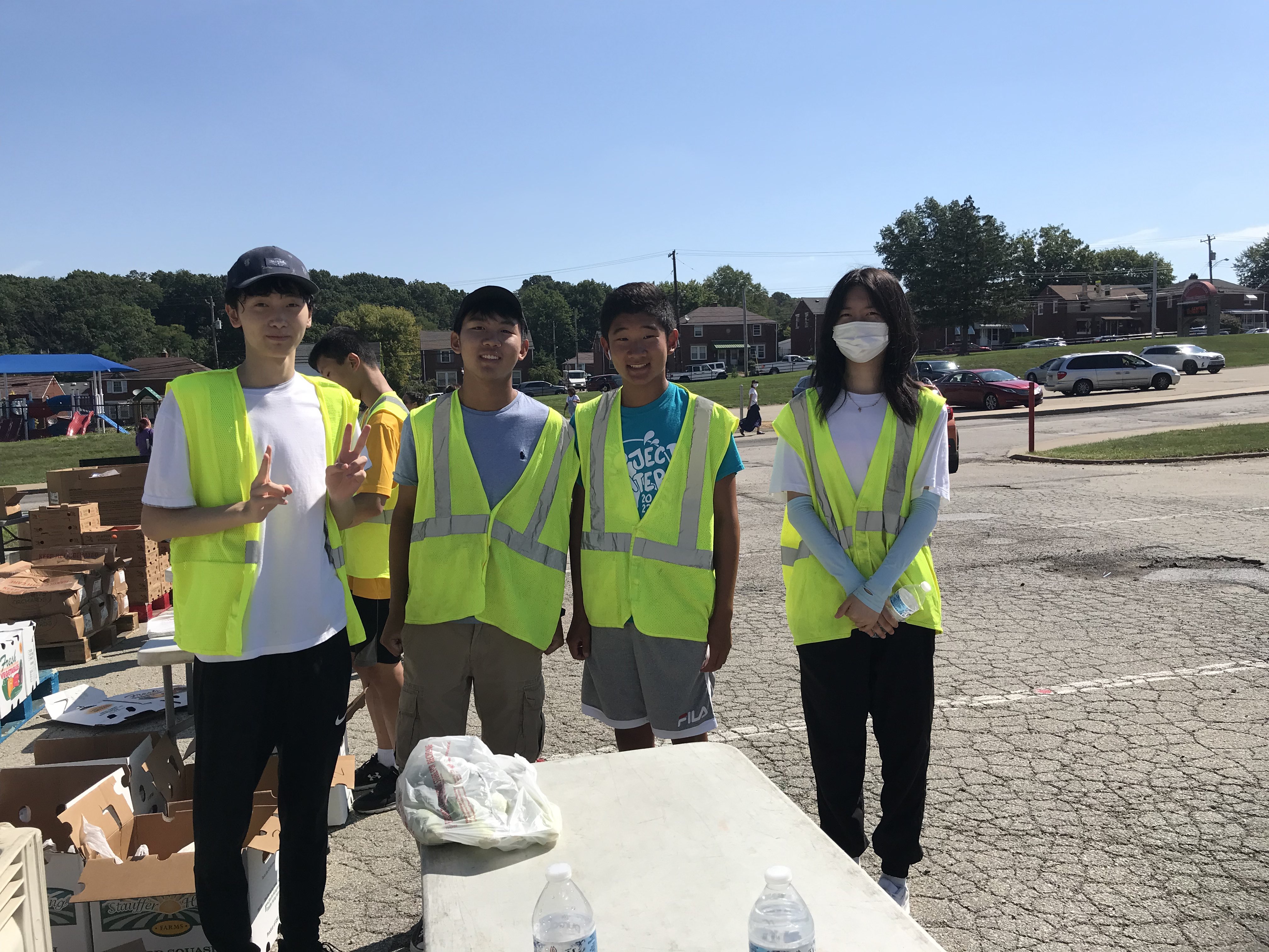 PCA youth volunteers helping at a community food distribution